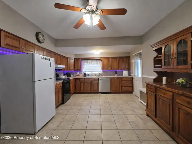 a kitchen with a refrigerator a sink and dishwasher