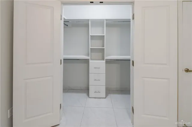 a view of an empty walk in closet