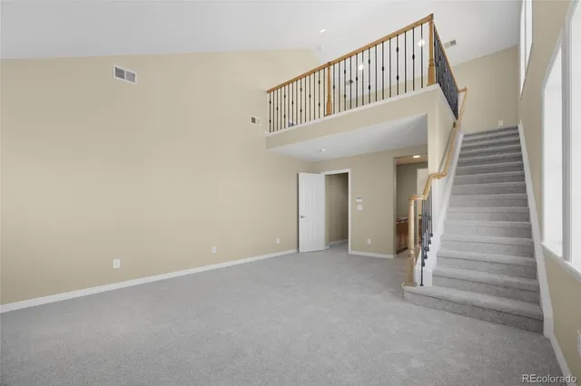 a view of staircase with white walls