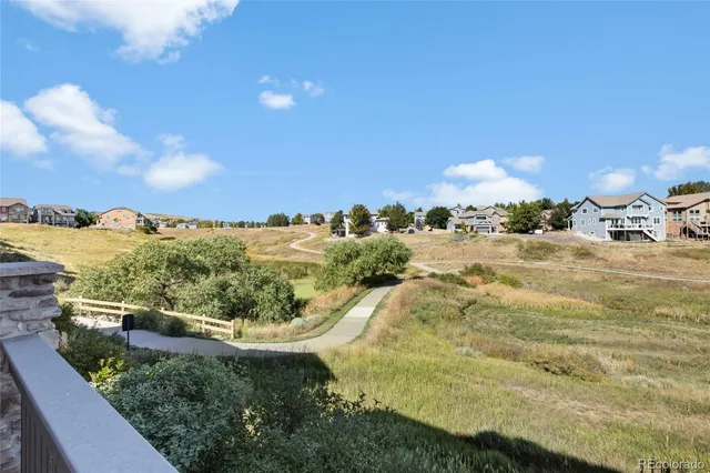a view of a pathway both side of building and yard