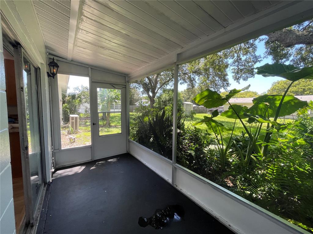 9244 Cyril Court Spring Hill, FL 34608 - Photo 26 of 30 a view of a porch in front of a house