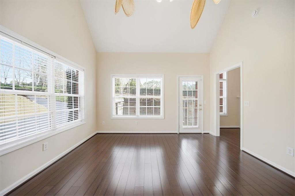111 Stonegate Lane Canton, GA 30114 - Photo 9 of 30 a view of an empty room with wooden floor and a window