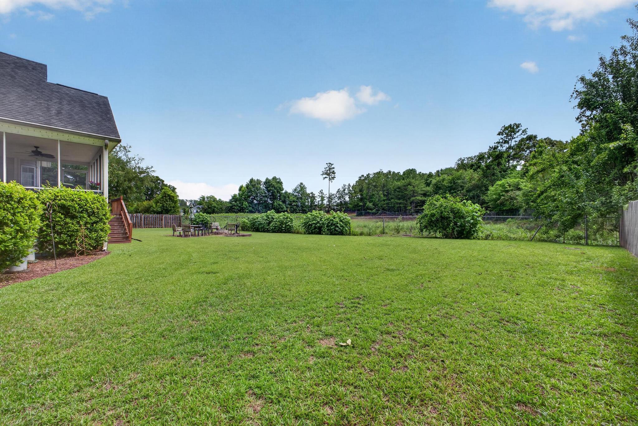 42 Emerald Ridge Aiken, SC 29803 - Photo 28 of 33 a view of a big yard with plants and a large tree