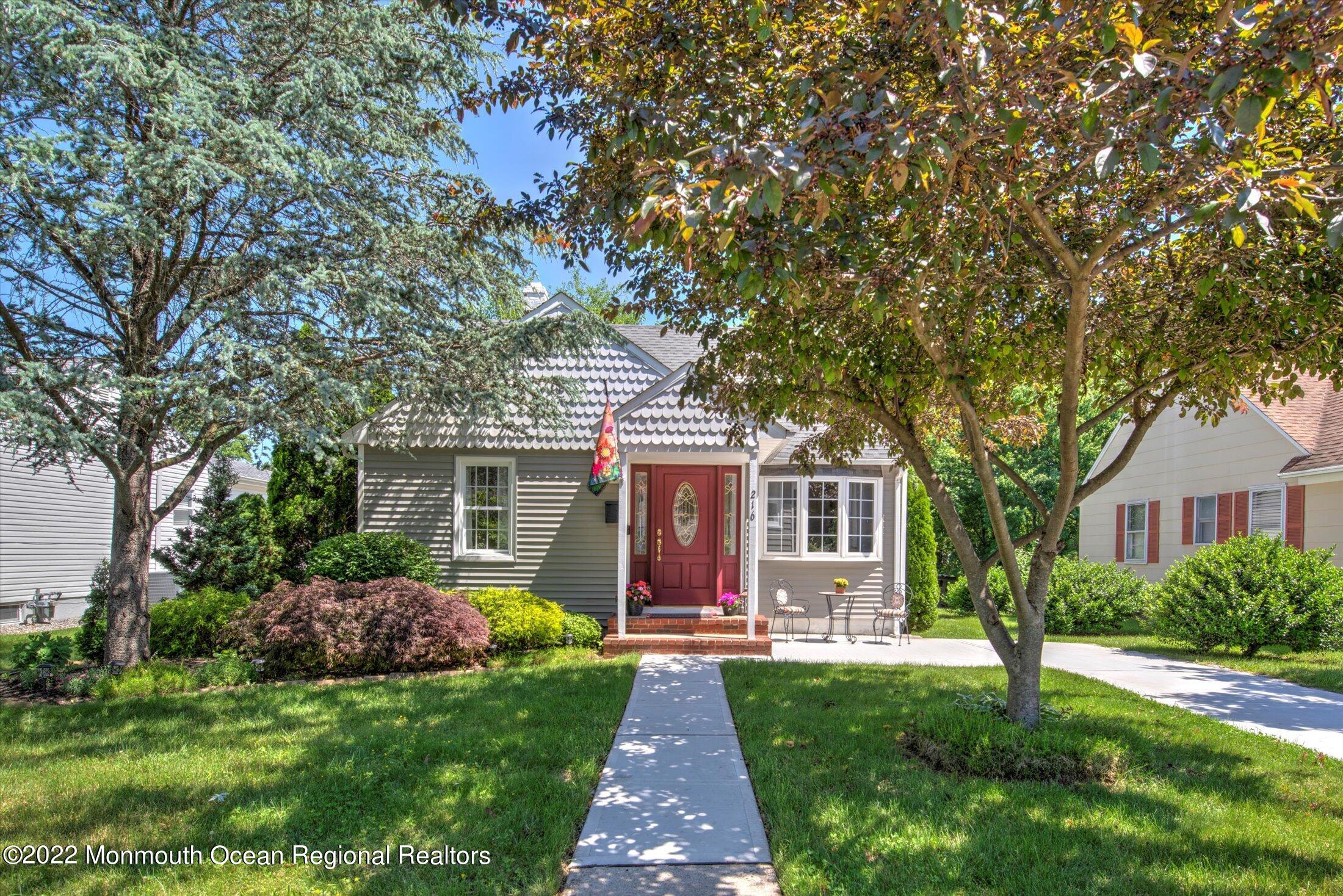 front view of a house with a yard