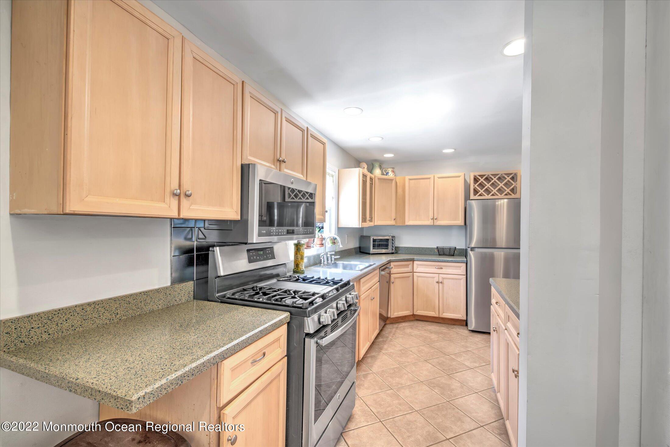 216 West Prospect Avenue Keyport, NJ 07735 - Photo 20 of 47 a kitchen with a stove a sink and a refrigerator