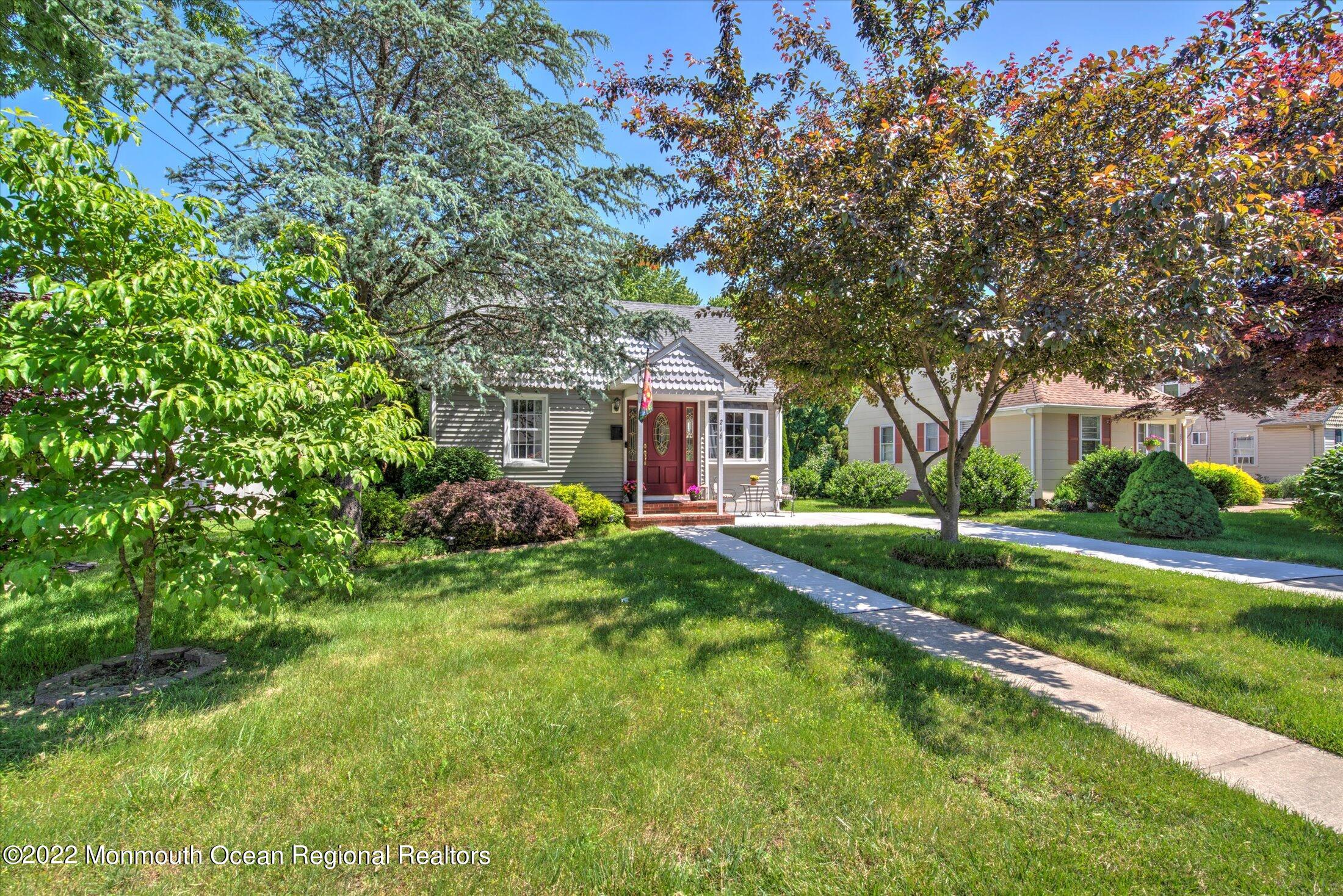 216 West Prospect Avenue Keyport, NJ 07735 - Photo 2 of 47 a front view of a house with yard and green space