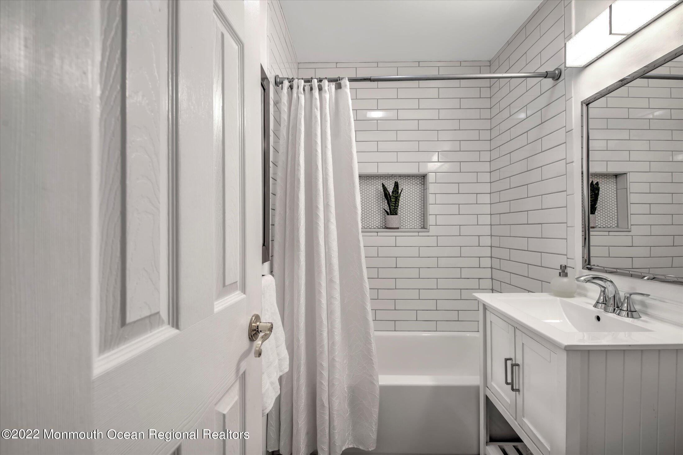 216 West Prospect Avenue Keyport, NJ 07735 - Photo 31 of 47 a bathroom with a bathtub a sink and a shower