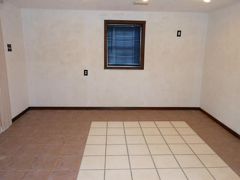 119 Fosterville Road Greensburg, PA 15601 - Photo 14 of 18 Other. This room could be a 4th bedroom a game room or a mother in law suite. You can walk right out to the yard.