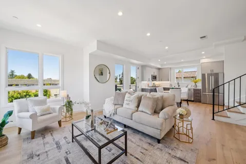 a living room with furniture and a table