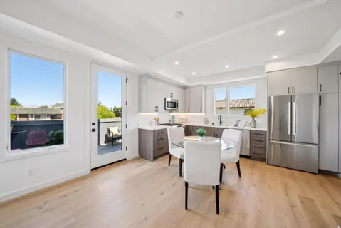 a kitchen with a sink cabinets and window