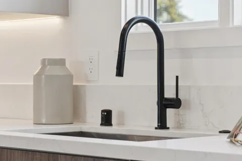 a stove top oven sitting inside of a kitchen