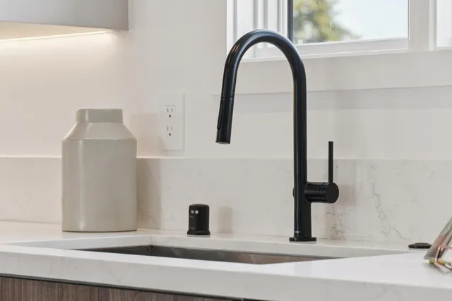 a stove top oven sitting inside of a kitchen