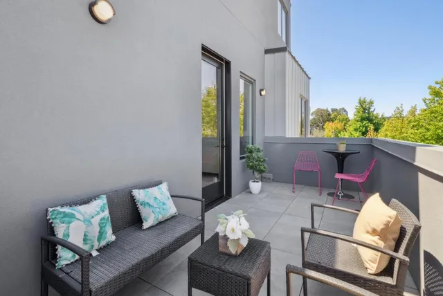 a bedroom with a bed and painting on the wall