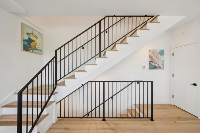 a bedroom with a bed and a potted plant