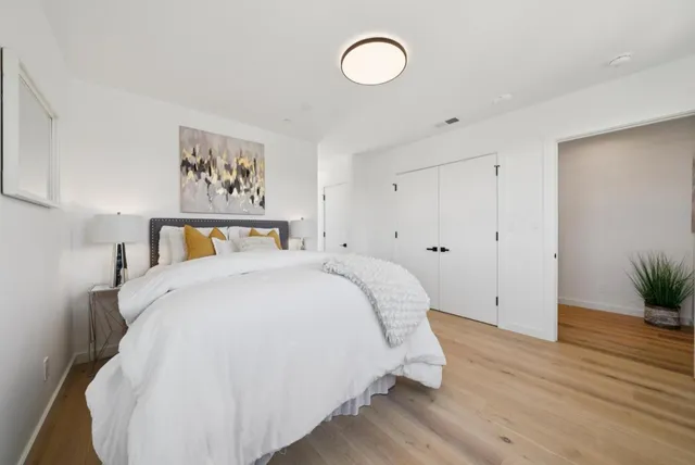a bathroom with a sink shower and a mirror
