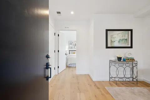 a view of a workspace with furniture and cabinet in a room