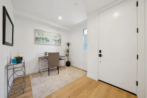 a bedroom with bed and window