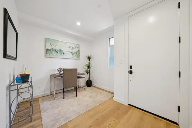 a bedroom with bed and window