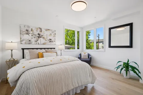 a bedroom with a bed and a table