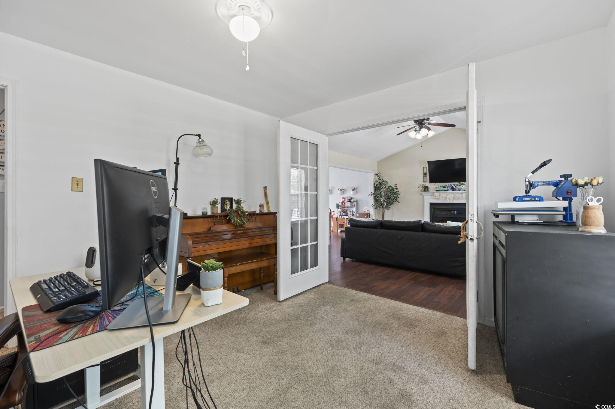 7530 Maple Swamp Road Gresham, SC 29546 - Photo 14 of 40 Office area featuring carpet, a fireplace, a ceili