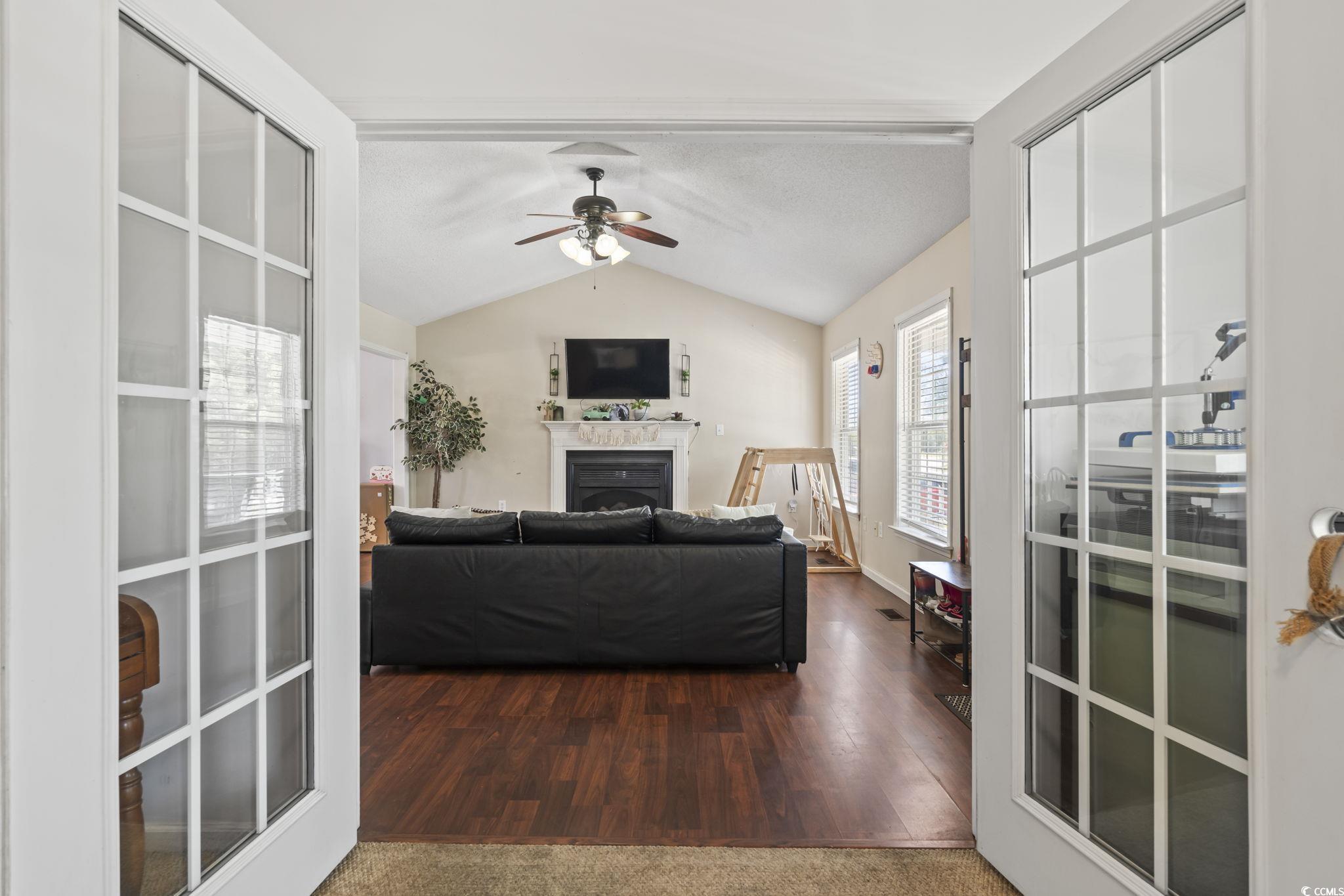 7530 Maple Swamp Road Gresham, SC 29546 - Photo 16 of 40 Living room featuring a fireplace, a ceiling fan,