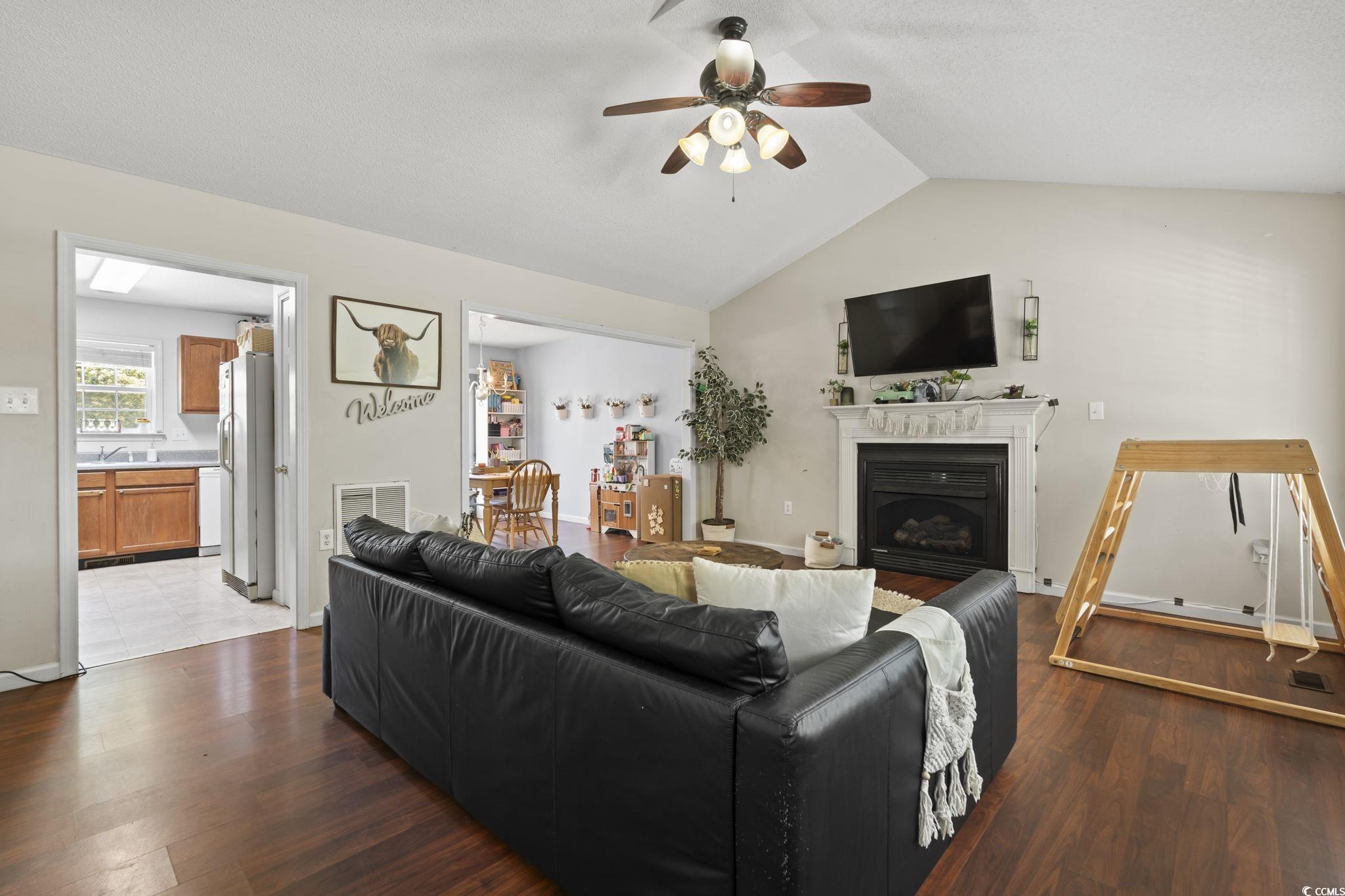 7530 Maple Swamp Road Gresham, SC 29546 - Photo 3 of 40 Living area with a fireplace, lofted ceiling, wood
