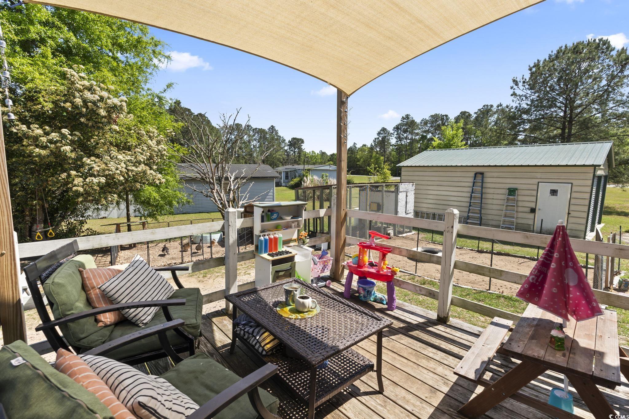 7530 Maple Swamp Road Gresham, SC 29546 - Photo 34 of 40 Wooden deck with an outdoor structure