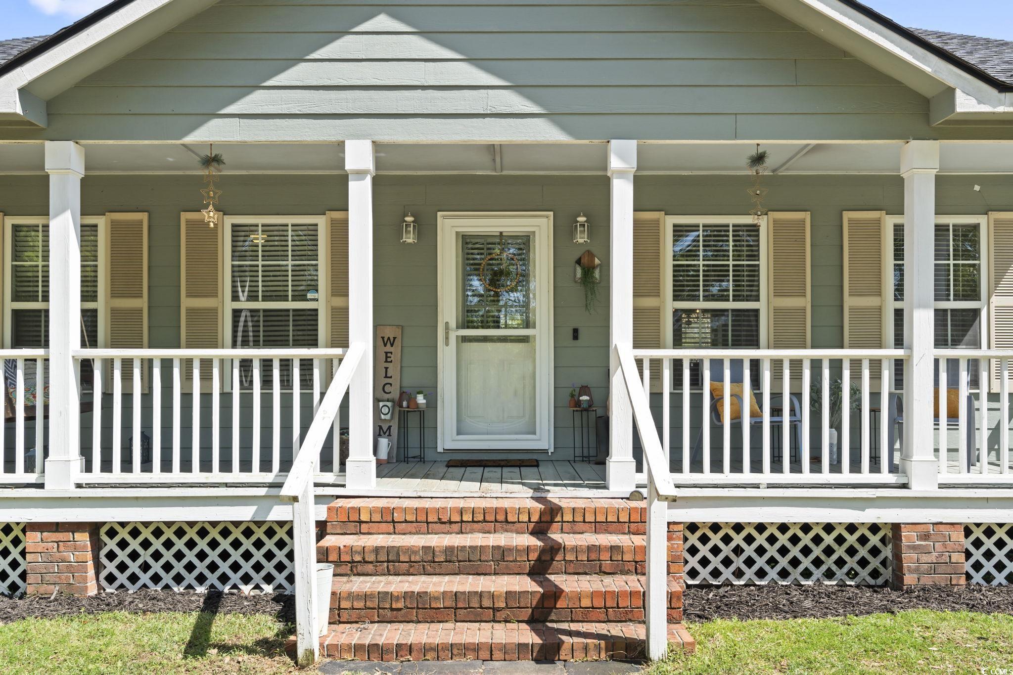 7530 Maple Swamp Road Gresham, SC 29546 - Photo 36 of 40 View of exterior entry with a porch