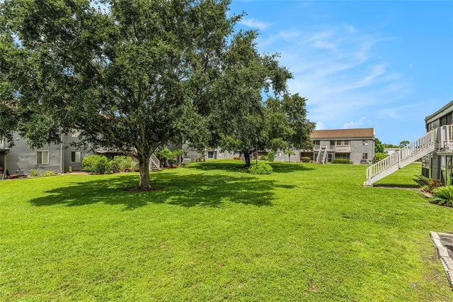 a view of a house with a big yard