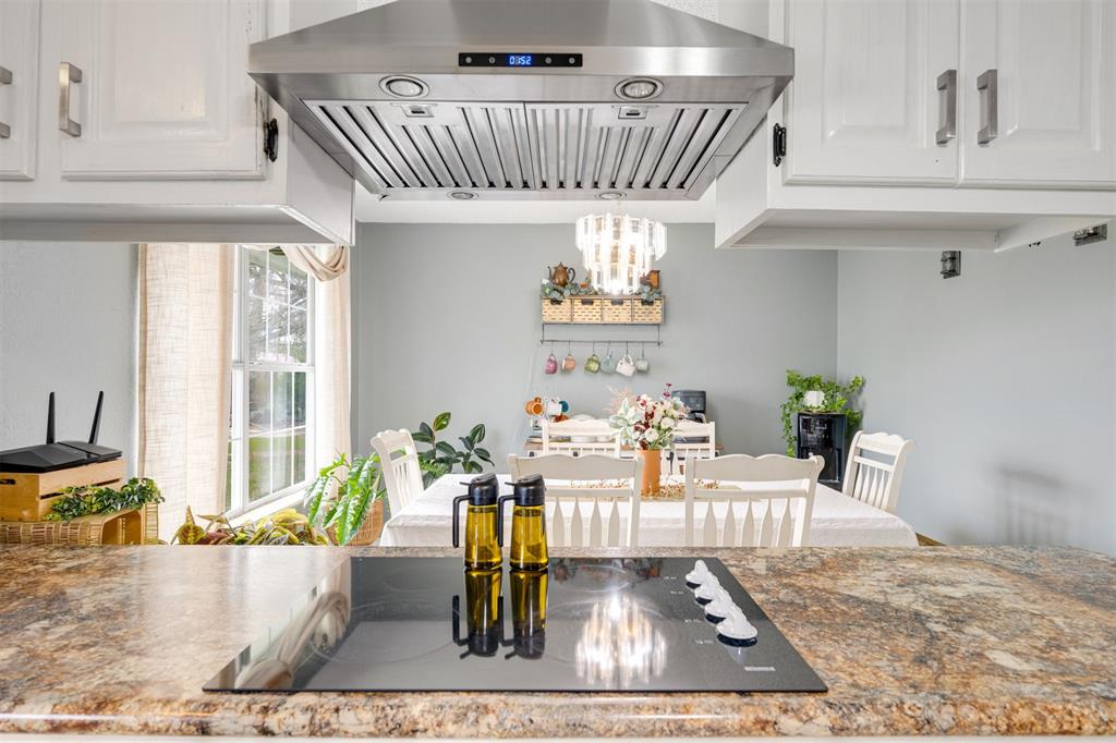1876 Farm To Market 906 Powderly, TX 75473 - Photo 12 of 38 a view of a living room and dining room