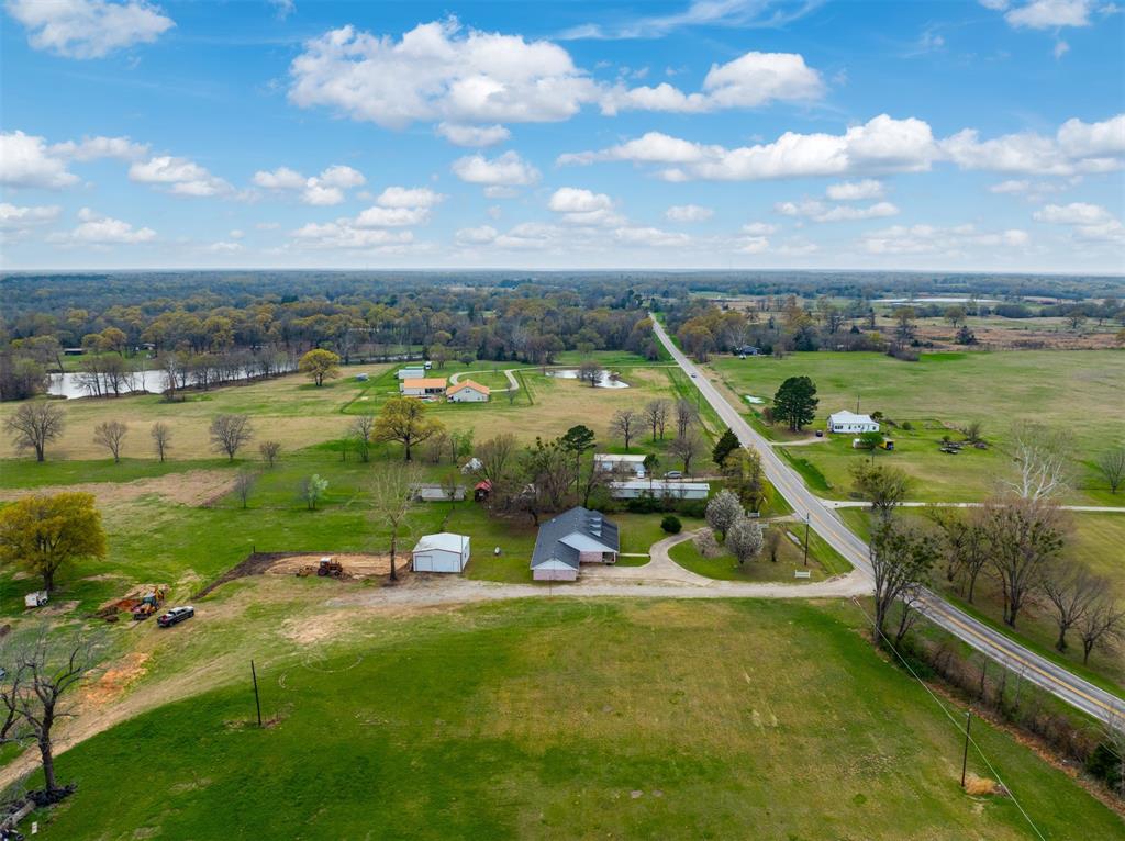 1876 Farm To Market 906 Powderly, TX 75473 - Photo 35 of 38 an aerial view of a house with a yard