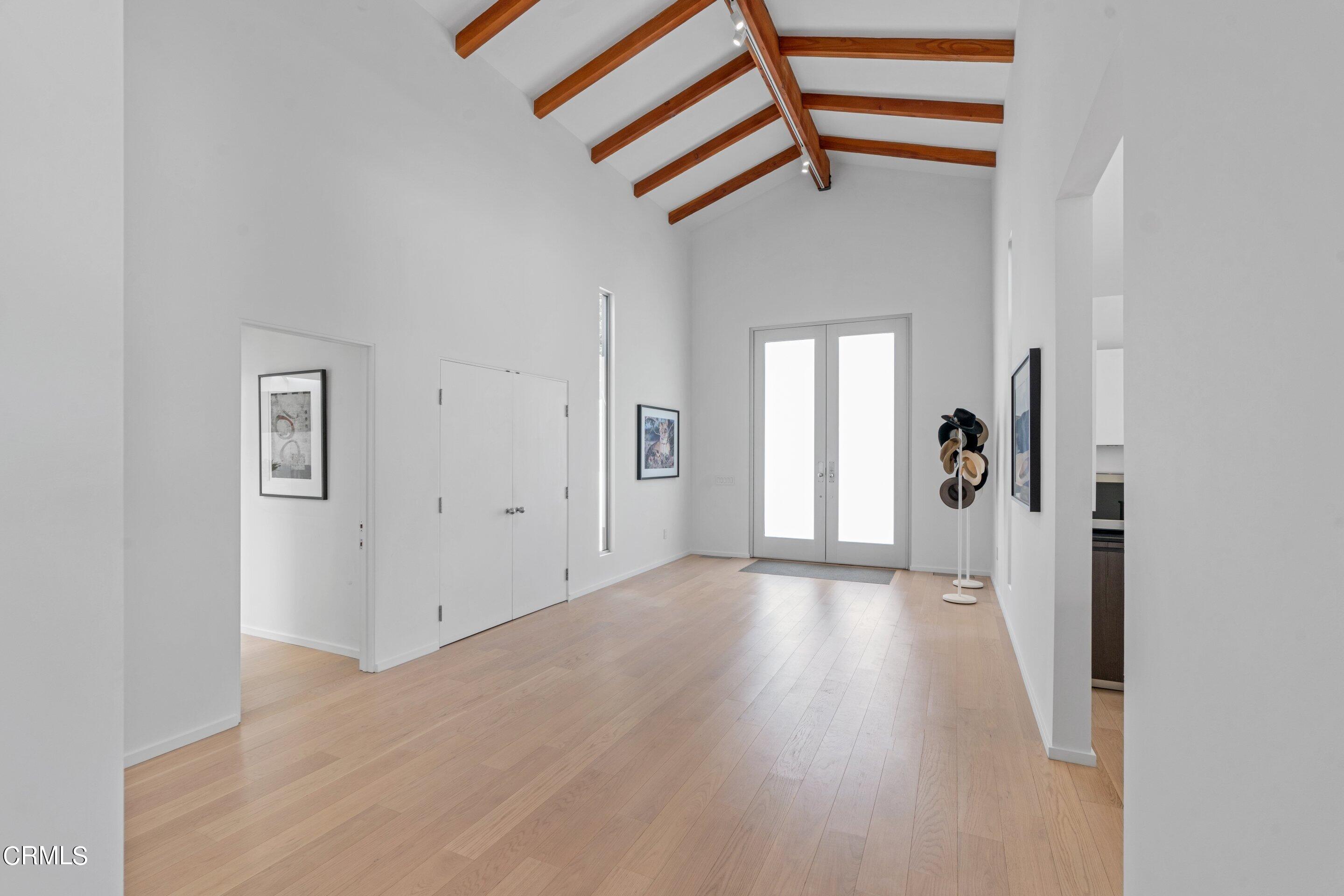1460 Linda Ridge Road Pasadena, CA 91105 - Photo 12 of 63 a view of a hallway with wooden floor and staircase
