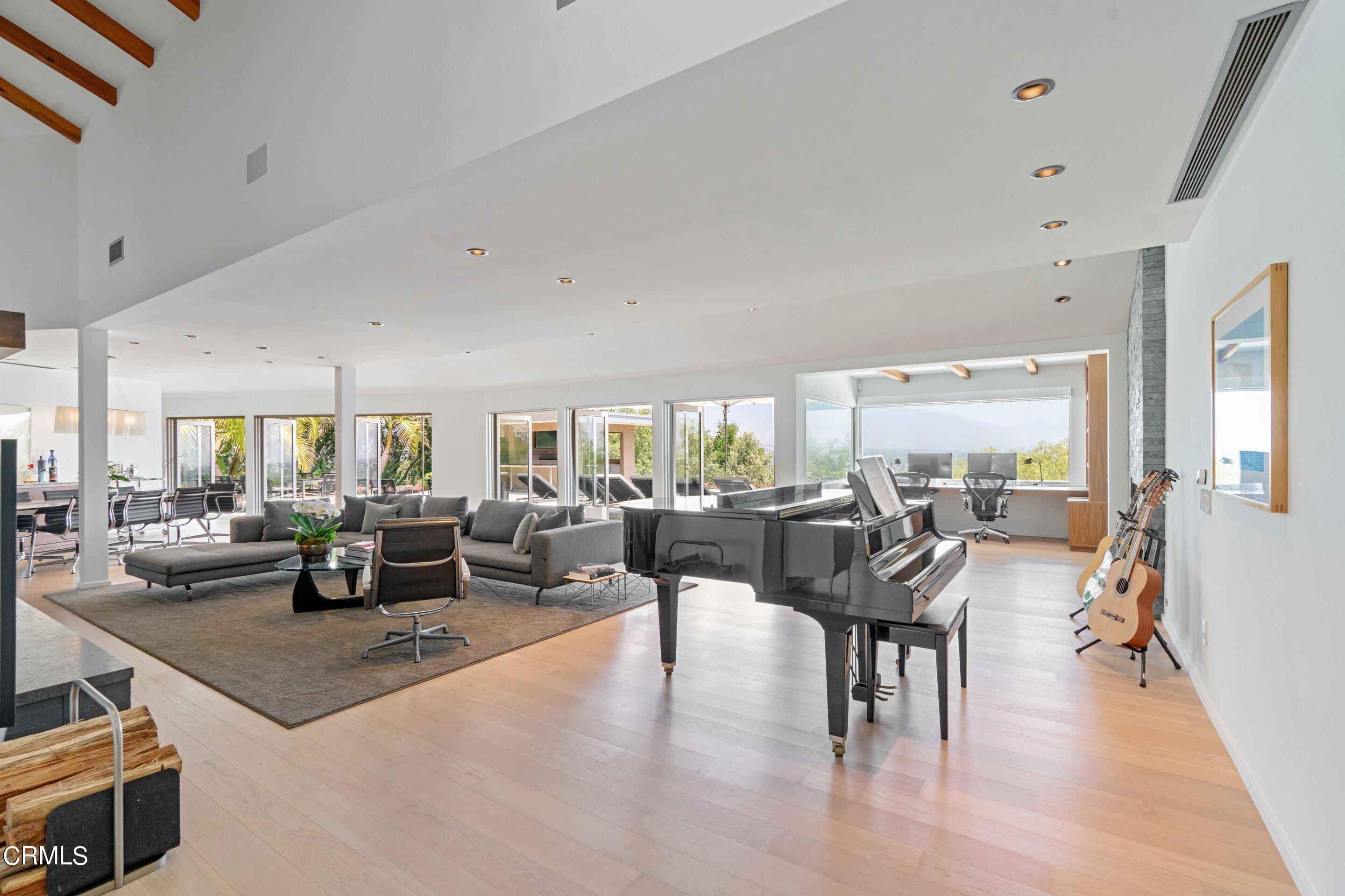 1460 Linda Ridge Road Pasadena, CA 91105 - Photo 19 of 63 a living room with lots of furniture and a large window