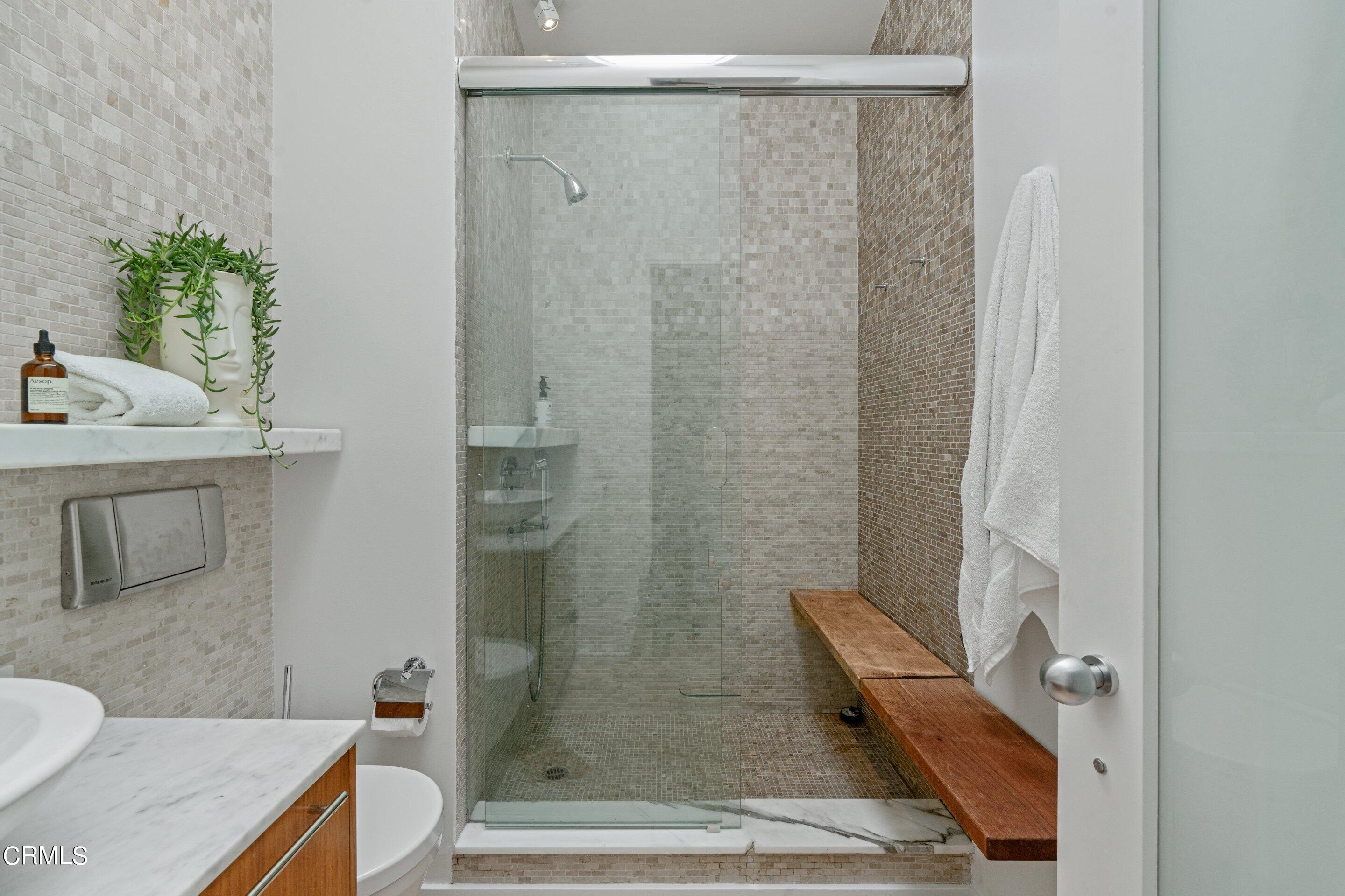 1460 Linda Ridge Road Pasadena, CA 91105 - Photo 35 of 63 a bathroom with a granite countertop sink a toilet and shower