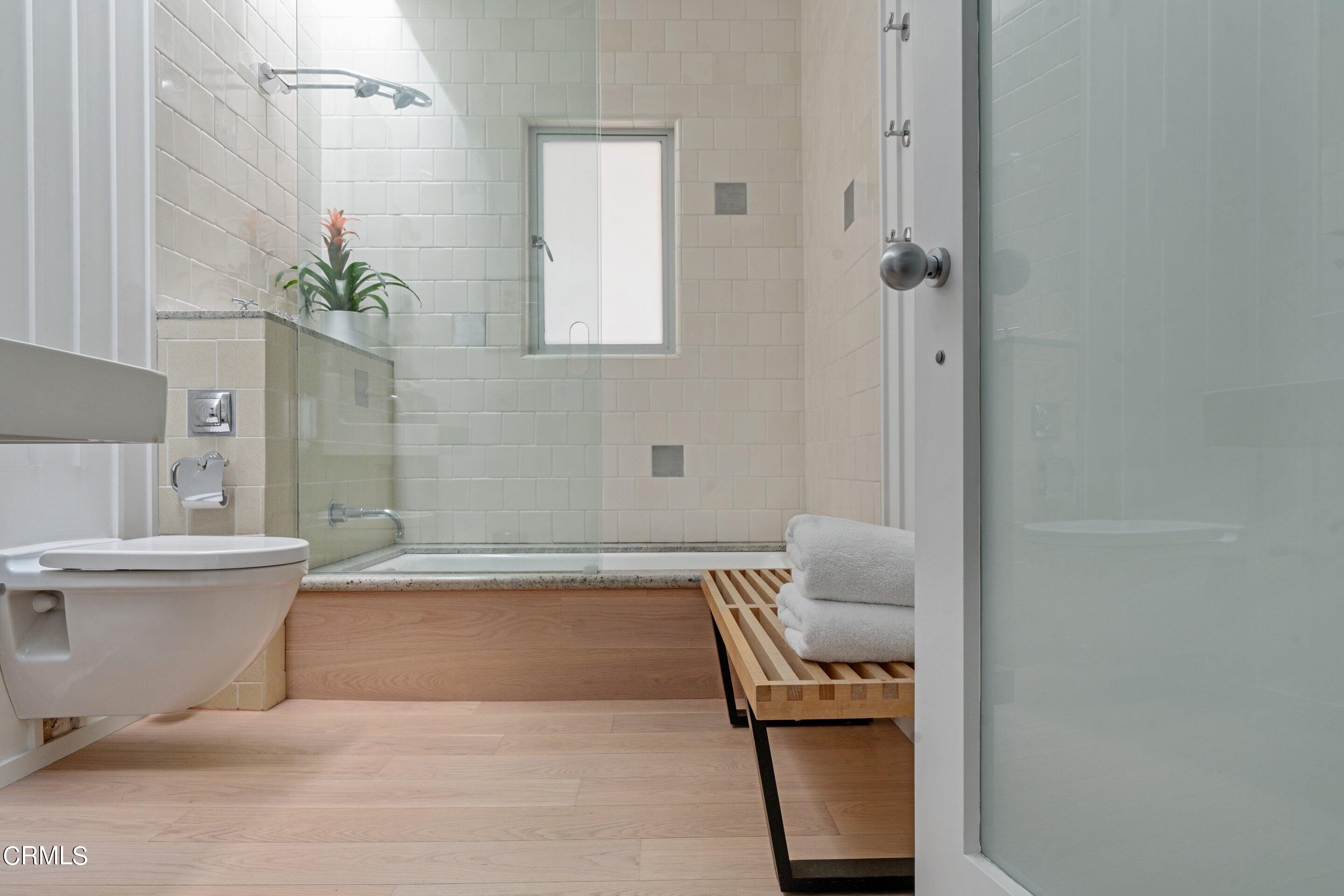1460 Linda Ridge Road Pasadena, CA 91105 - Photo 37 of 63 a bathroom with a tub shower and a sink