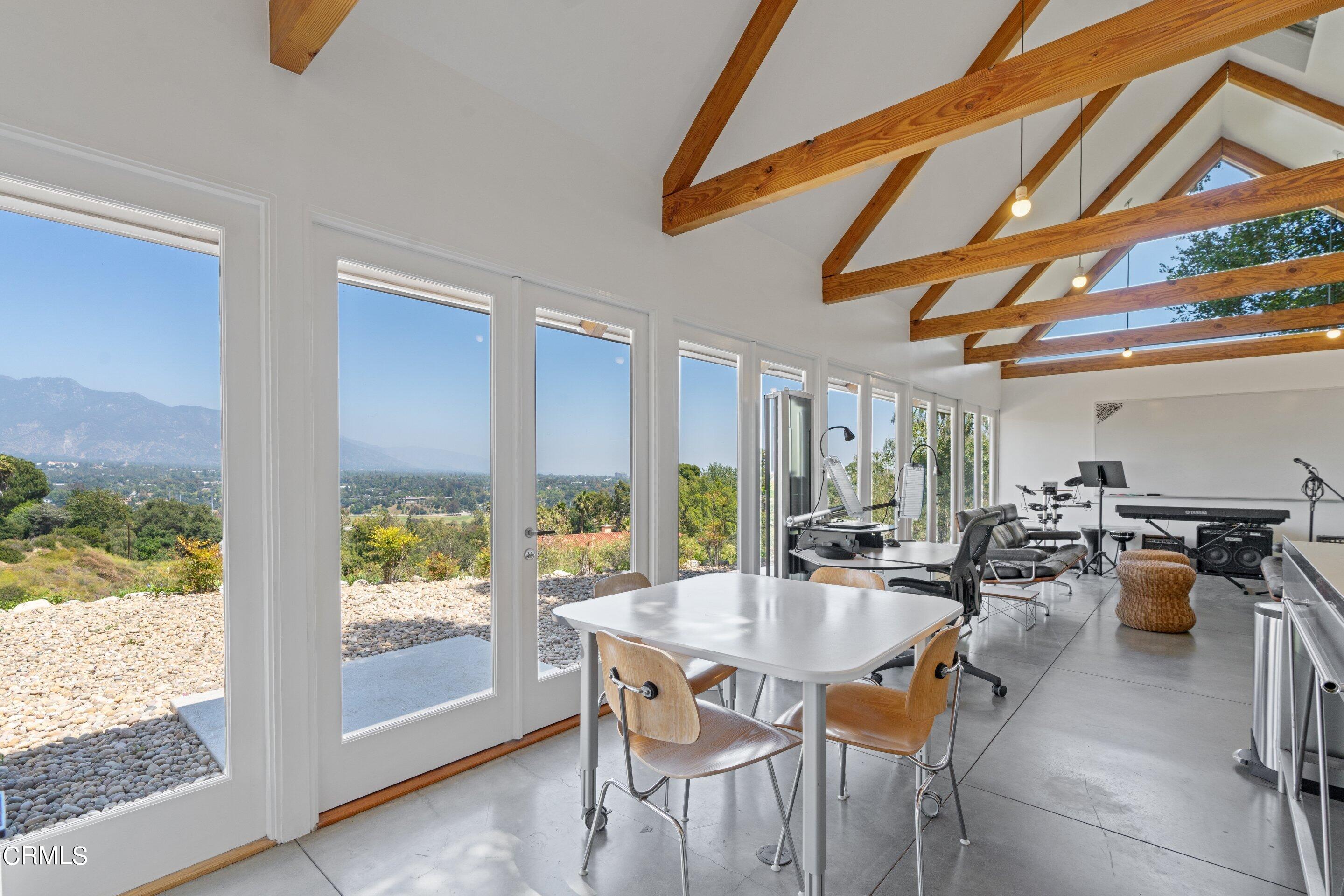 1460 Linda Ridge Road Pasadena, CA 91105 - Photo 46 of 63 a dining room with furniture and a floor to ceiling window