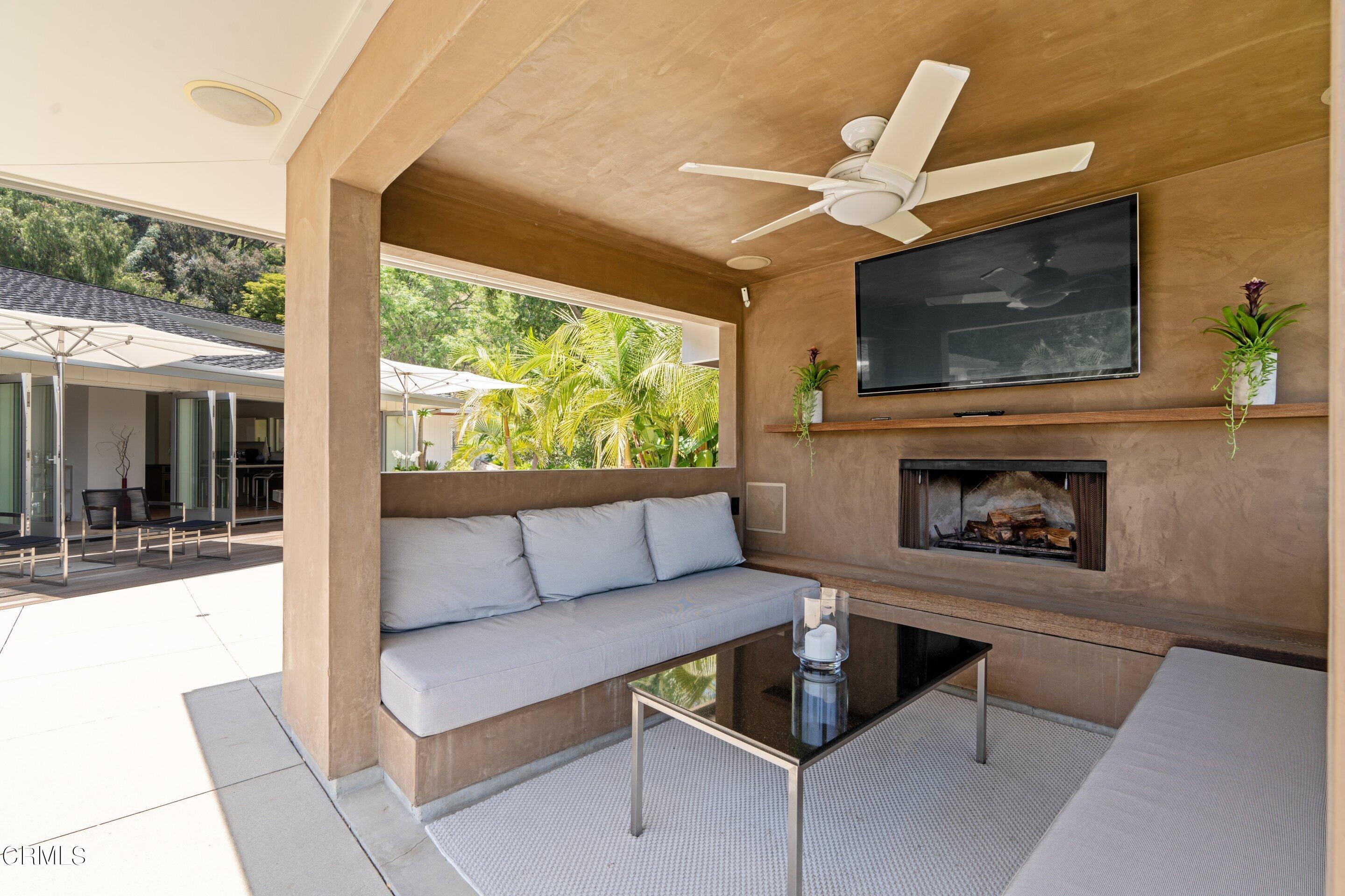 1460 Linda Ridge Road Pasadena, CA 91105 - Photo 52 of 63 a living room with furniture a fireplace and a flat screen tv