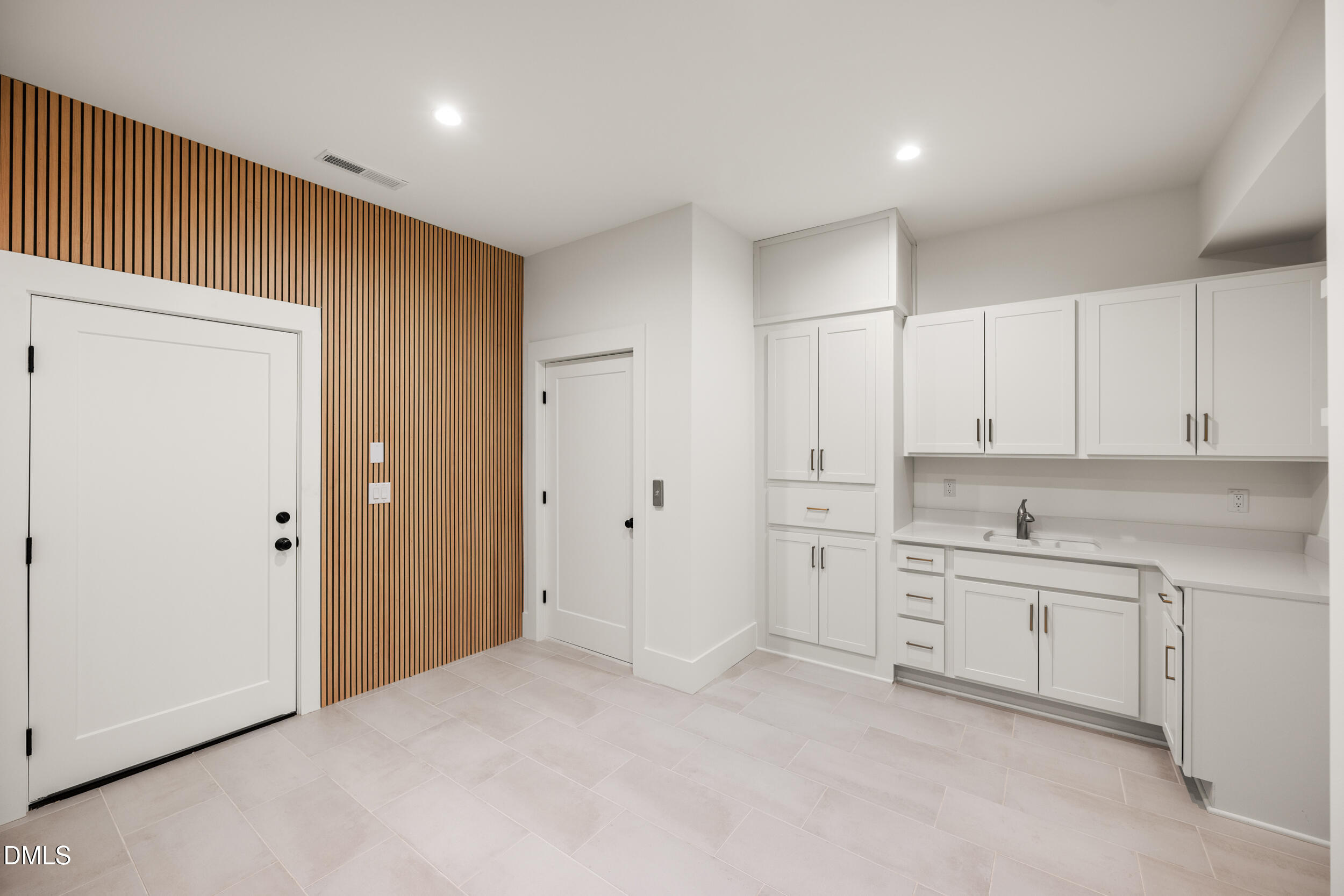 2817 Claremont Road Raleigh, NC 27608 - Photo 60 of 73 a kitchen with white cabinets and sink