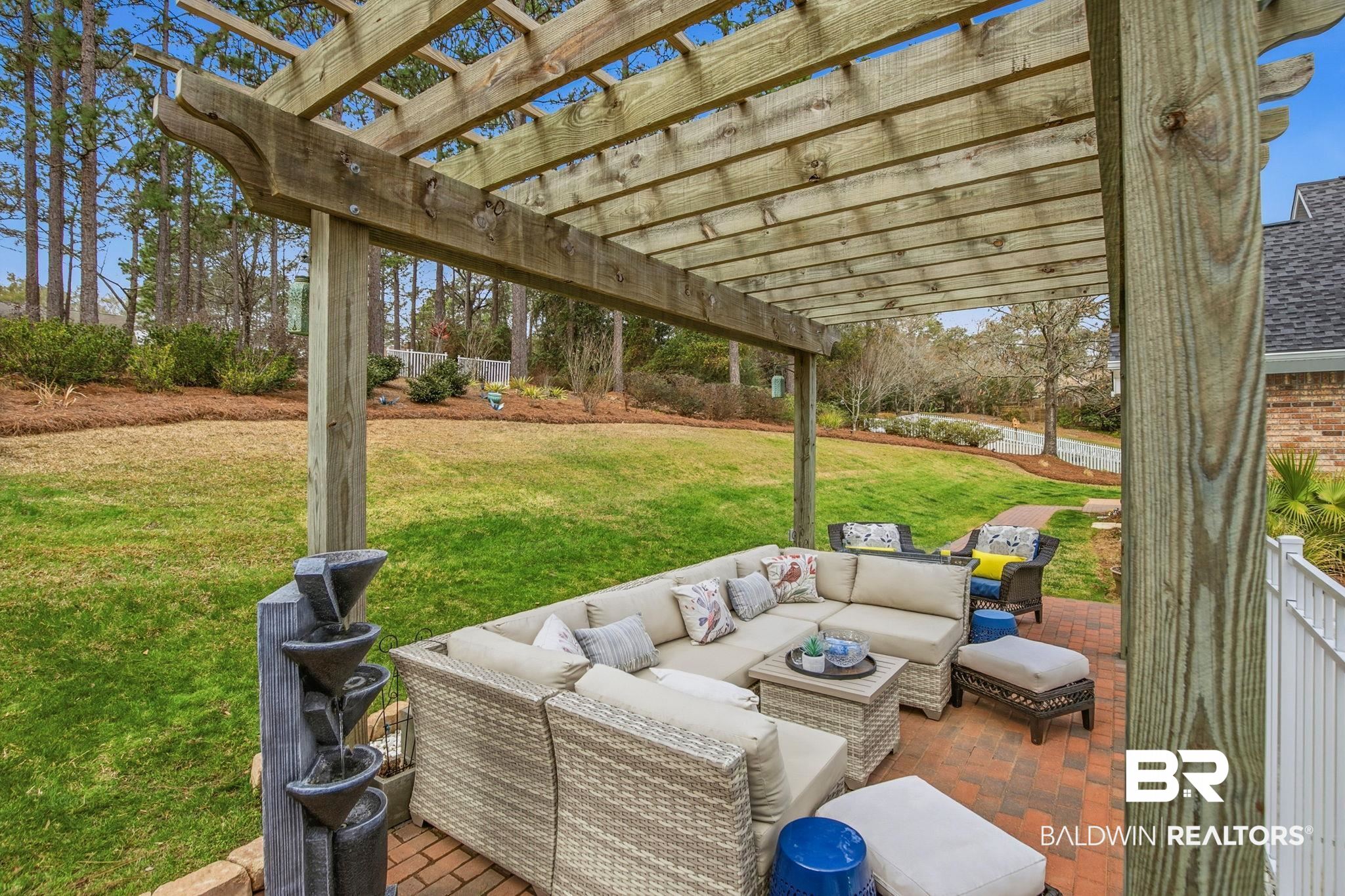 31515 Rhett Drive Spanish Fort, AL 36527 - Photo 80 of 100 Enjoy the evening sunsets with the fountain, outdoor seating area with fire pit. Pergola furniture & fire pit will convey with the home.