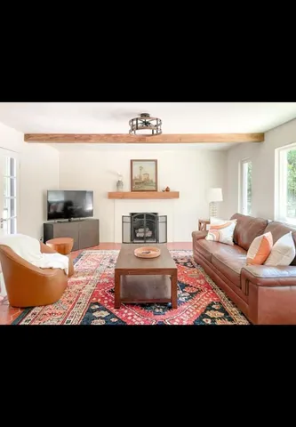 a kitchen with a sink a counter top space and appliances
