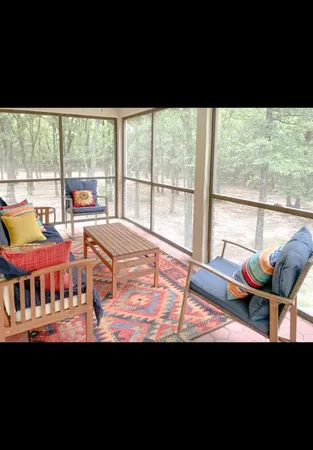 a view of living room with furniture and wooden floor