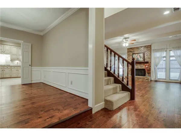 a view of an entryway with wooden floor