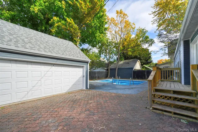 a backyard of a house with oven and entertaining space