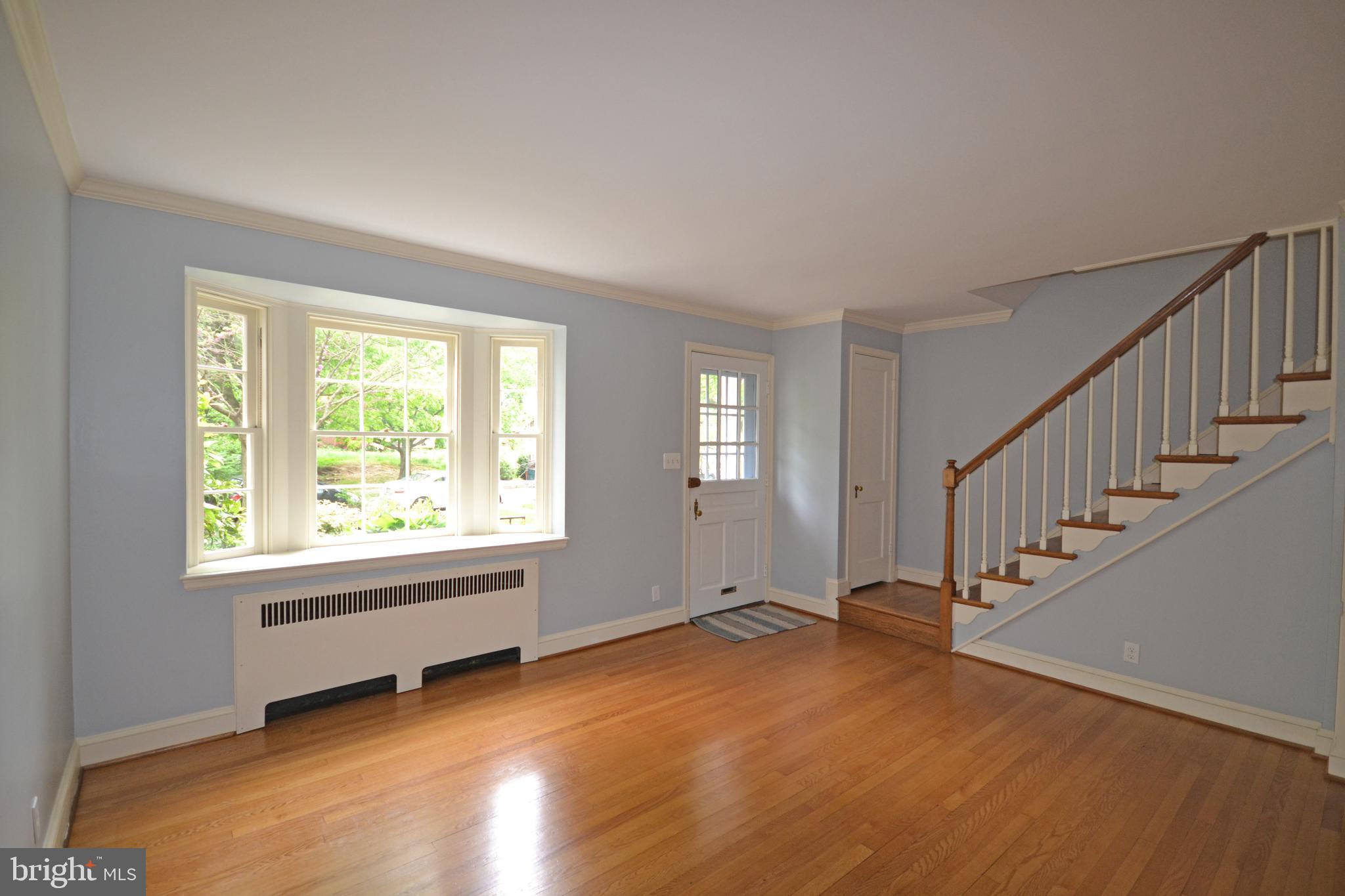 1218 Northview Road Baltimore, MD 21218 - Photo 3 of 33 Spacious Living Room with bowfront windows