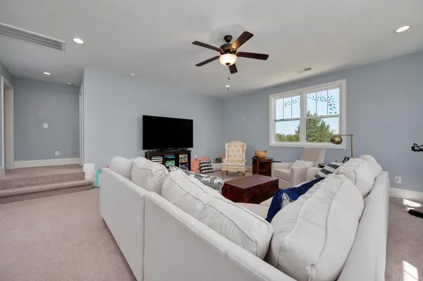 a children room with toys and a window