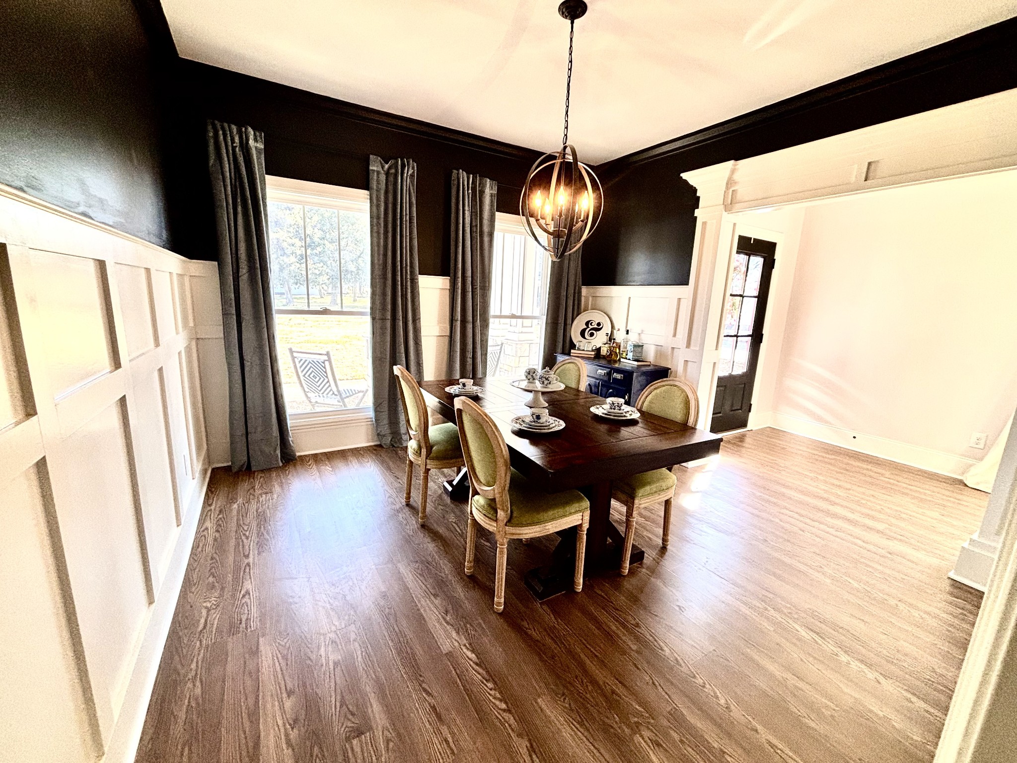 2963 Emery Road Murfreesboro, TN 37130 - Photo 20 of 23 a dining room with wooden floor a chandelier a wooden table and chairs