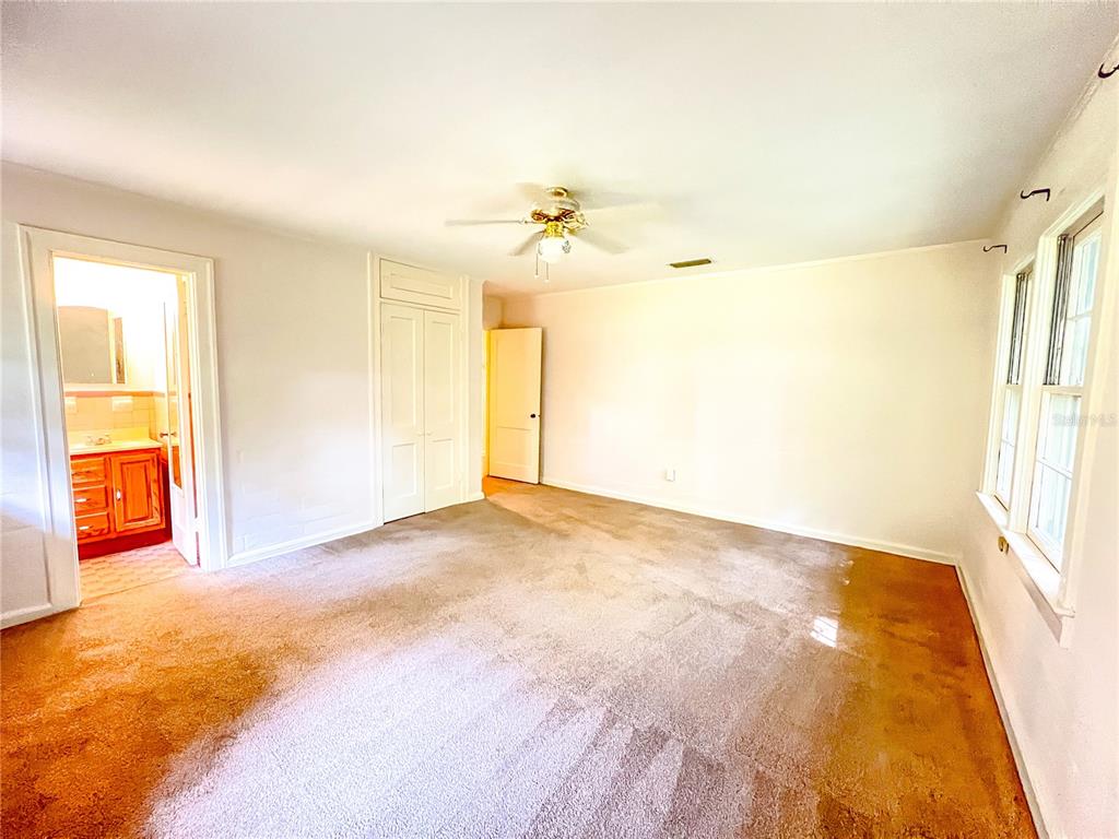 1403 Northwest 11th Road Gainesville, FL 32605 - Photo 13 of 15 a view of an empty room with a window