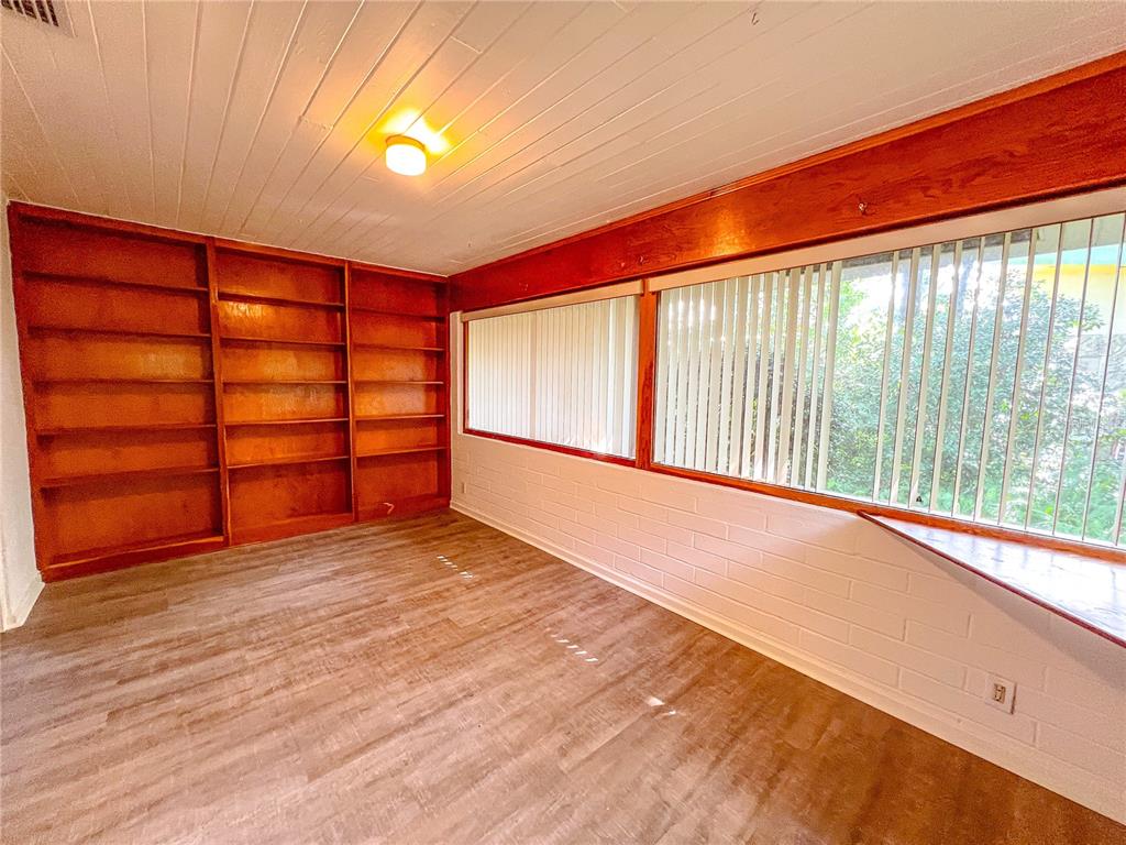 1403 Northwest 11th Road Gainesville, FL 32605 - Photo 4 of 15 a view of an empty room with a window