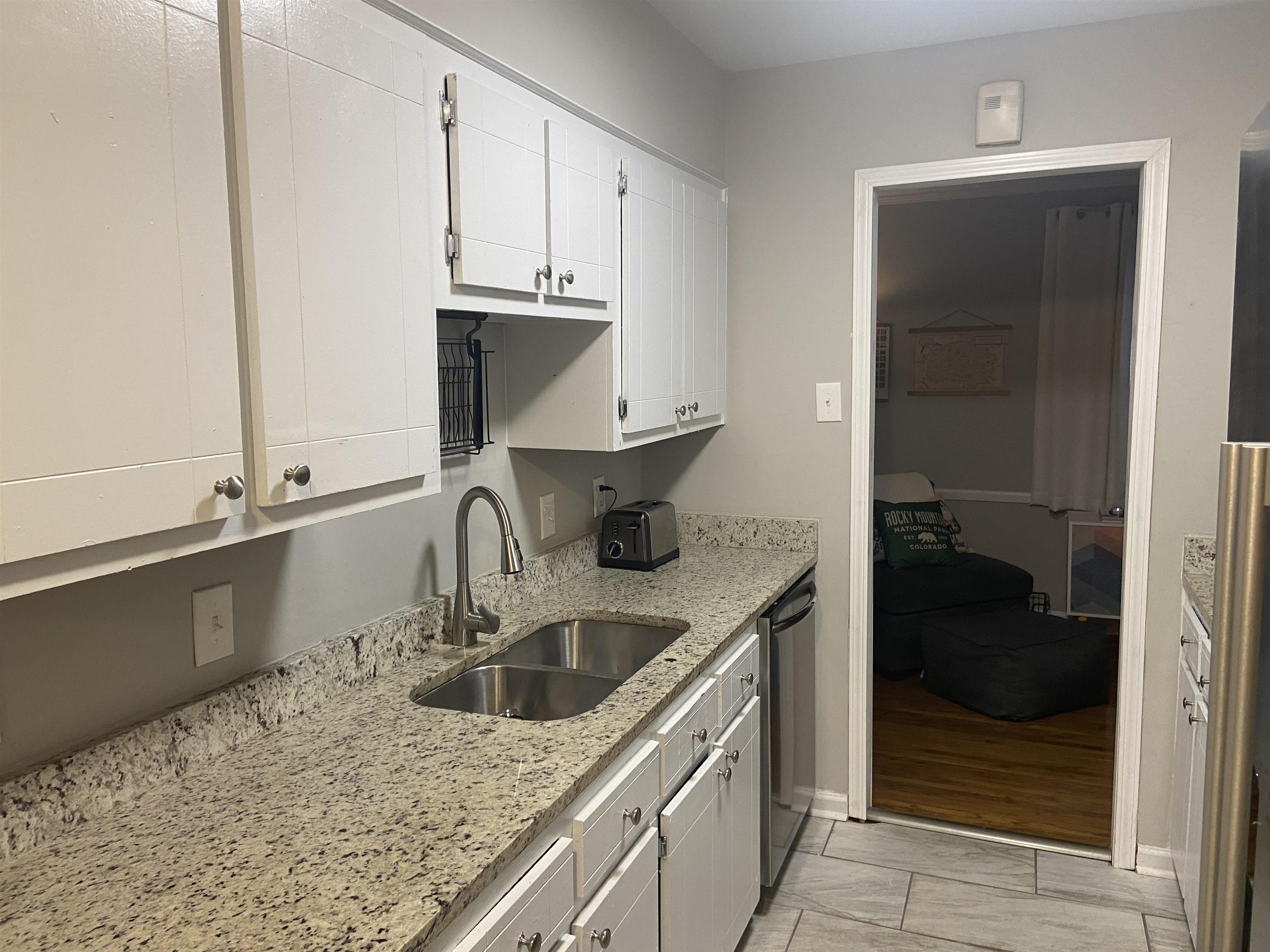 4732 Helene Road Memphis, TN 38117 - Photo 8 of 20 a kitchen with a sink and cabinets