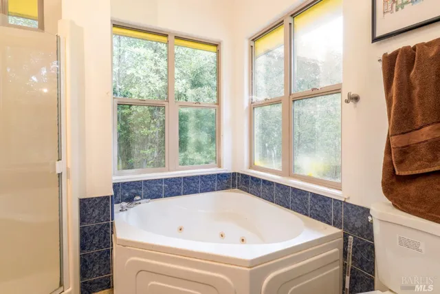 a bath tub sitting next to a window